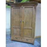 Late 19th C continental waxed pine linen press, stepped cornice and double panelled doors above a