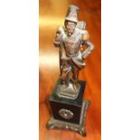 Cast patinated bronze model of a French Hussar, on square polished slate plinth and shaped base (