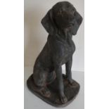 Composition model of a seated gun dog, on oval plinth (height 61cm)