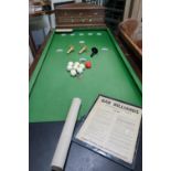 Bar Billiards table with green baise top, mushrooms balls, cues and table brush with an E.A.A