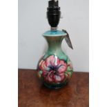 Moorcroft Hibiscus pattern mallet shaped table lamp, with impressed mark and part of old label, (