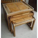 1970s nest of three teak framed tiled topped tables