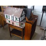 Scratch built Tudorbethan style dolls house, oak two tier trolley with cutlery drawer, three