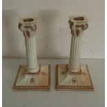 Pair of Victorian Royal Worcester candlesticks, with stop fluted columns and acanthus scroll