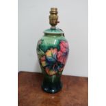 Moorcroft Hibiscus pattern baluster shaped table lamp, with impressed green mark, (33.5cm max)