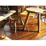Two late 19th C beech milking stools