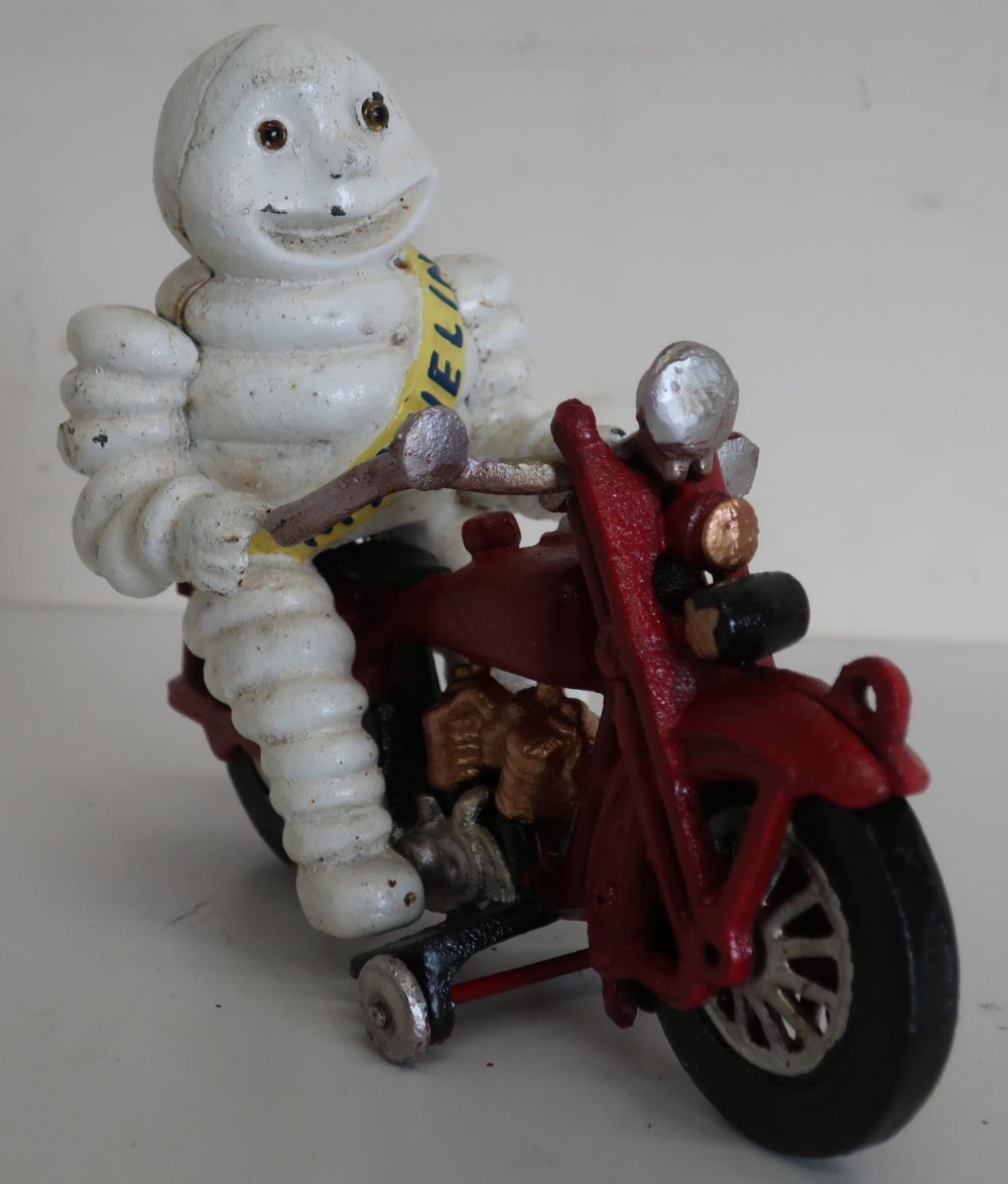 Michelin man on red painted motorcycle