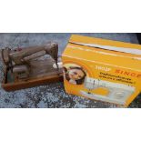 Singer 2802 P Electric Sewing Machine in original box and packaging with instructions, and a vintage
