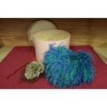 A green velvet and ostrich feather ladies hat by McDonalds, James St. Harrogate