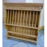 Contemporary waxed pine plate rack with moulded corners, carved acorn and oak leaf decoration (