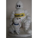 Cast and painted metal Michelin man figure with a dog (height 22cm)