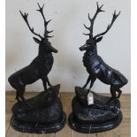 Pair of patinated cast metal models of "Stags at bay after J.Moigniez, on oval bases (76cm ) (2)