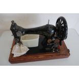 Vintage Singer sewing machine 9411069 in domed topped wooden case
