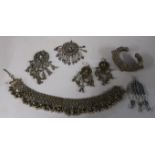 Collection of Yemeni silver jewellery incl. a pair earrings and a pendant, two similar pendants,