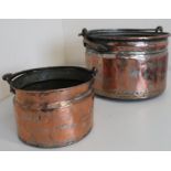 Graduated pair of Eastern brass and copper circular pans with snake scroll handles (diameter