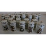 Collection of twenty two M G Hummel spice jars and covers, decorated with children