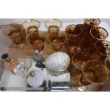 Set of six amber glass tumblers, similar set of six smaller tumblers, other amber glass gilt