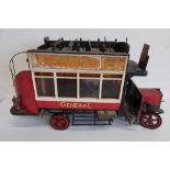 Tinplate model of a vintage London bus L138, service 15C with Dewars Whisky advert, on spoked wheels