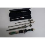 Letter knife in the form of Victorian officers dress sword, and five others (6)