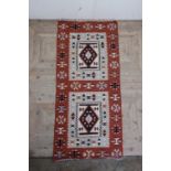 Two brown ground Kilim rugs, both traditional geometric designs (100cm x 205cm) (2)