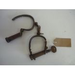 Pair of Hiatt warranted wrought iron handcuffs, stamped 123