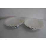 Pair of Belleek comports, impressed woven wickerwork decoration with pierced edges (diameter 26.5cm)