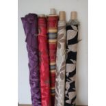 Five rolls of quality as new upholstery fabric of various lengths including 4.9m, 5m, 9.7m, 6.5m,
