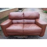 Large leather two seat sofa on raised circular wood supports (width 230cm) and a matching smaller