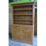 19th C waxed pine dresser, with three tier plate rack, above two drawers and two cupboards (126cm