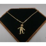 Italian gold gem set articulated clown stamped N0314, 4.5cm, on 14kt gold flattened link chain,