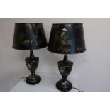 Pair of Toleware table lamps, the urn shaped bodies decorated with Oriental figures and pagodas in