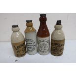 Two HG Lawrence & Sons Beccles stoneware ginger beer bottles, another Thomas Hoyles, and HW