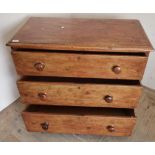 Victorian stained pine chest of three long drawers on bun feet (95cm x 49cm x 83cm)