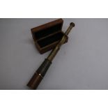 Small brass pocket telescope stamped "Thomas. J. Evans, London" in brass bound box