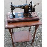 Jones Family C.S hand sewing machine, No. 4363S and an oak occasional table on barley twist