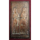 Hammered copper plaque decorated with two medieval style nuns on wooden plaque, (65cm x 33.5cm)