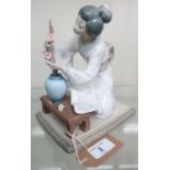 Lladro porcelain model of a Geisha arranging flowers, in original box with packaging (H20cm)