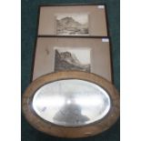 Arts & Crafts style oval bevelled edge mirror, the beaten copper brass frame with rib and bow