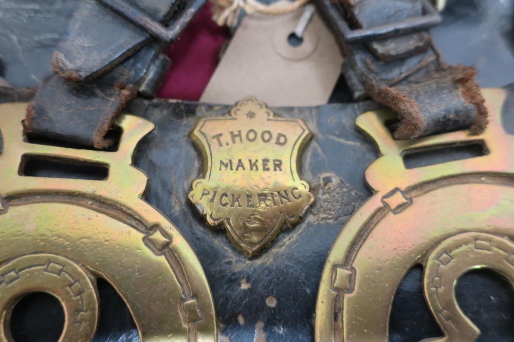 Collection of fifteen Victorian horse brasses on three leather straps, stamped T Hood, Maker - - Image 2 of 2