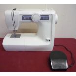 Toyota RS2000 Electric Sewing Machine with instruction manual, foot control etc and a Jones Electric