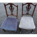 Pair of Edwardian walnut nursing chairs, with pierced carved splat and button upholstered seats,