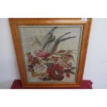 Late Victorian needlework panel depicting a parakeet perched on a branch surrounded by exotic
