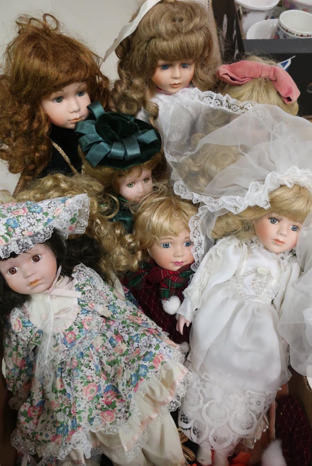 Collection of bisque head fashion and character dolls including a bride (9)