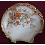 Royal Worcester shaped circular cabinet plate, with pierced border, centre painted with berries on a