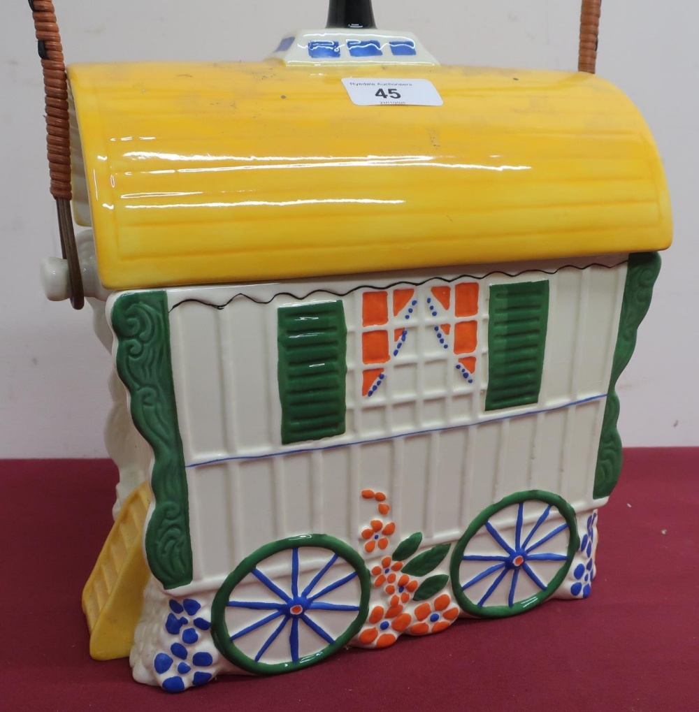Old Romany bone china biscuit barrel in the shape of a bow top gypsy caravan, with wicker bound