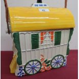 Old Romany bone china biscuit barrel in the shape of a bow top gypsy caravan, with wicker bound