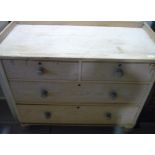Victorian pine chest with raised back and sides above two short and two long drawers, on turned
