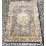 20th C Persian pattern rug, blue ground with floral central medallion scroll and floral pattern