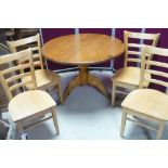 Pine circular top cafe style table (approx 110cm) and set of four modern beech ladder back chairs