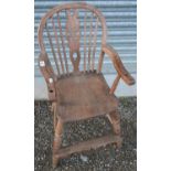 Late Victorian elm child's wheelback high chair, with H shaped understretcher and turned supports